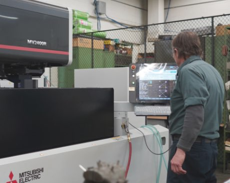Freeway Employee operating a CNC machining center to build components for in-house tooling